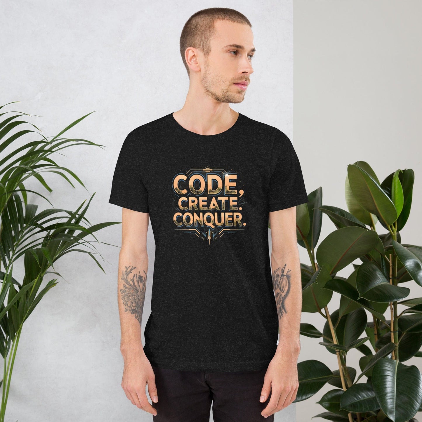 Man wearing black tech-style Code Create Conquer T-shirt with orange digital print design – ccanvas