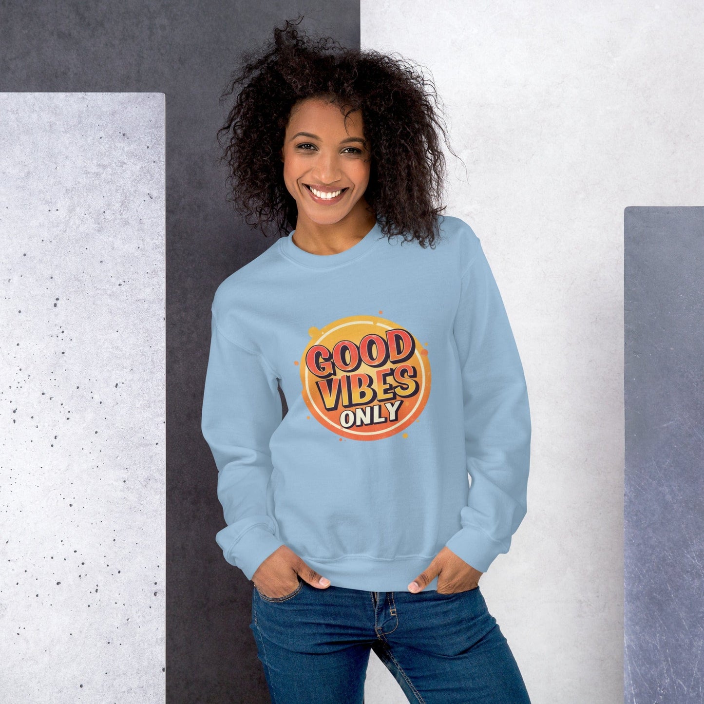 Smiling woman wearing blue sweatshirt with bold retro Good Vibes Only graphic design – ccanvas