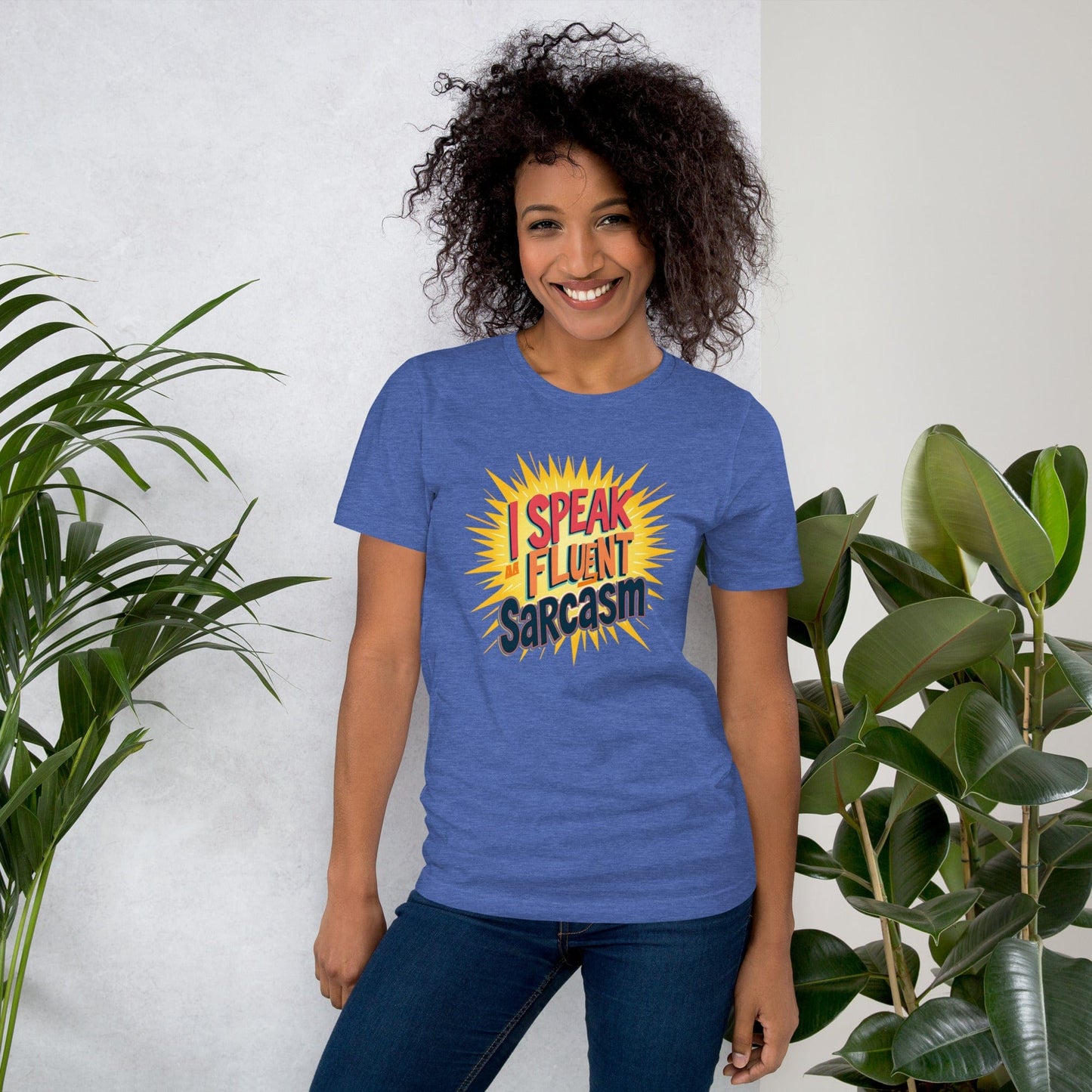Woman wearing blue T-shirt with bold comic-style I Speak Fluent Sarcasm quote design – ccanvas