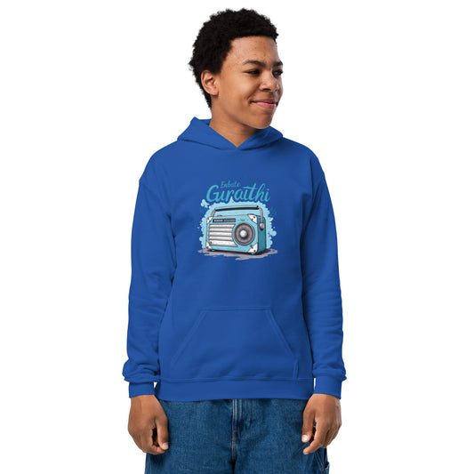Teen wearing royal blue hoodie with vintage radio and “Iskulte Guraathi” slogan in playful style at ccanvas