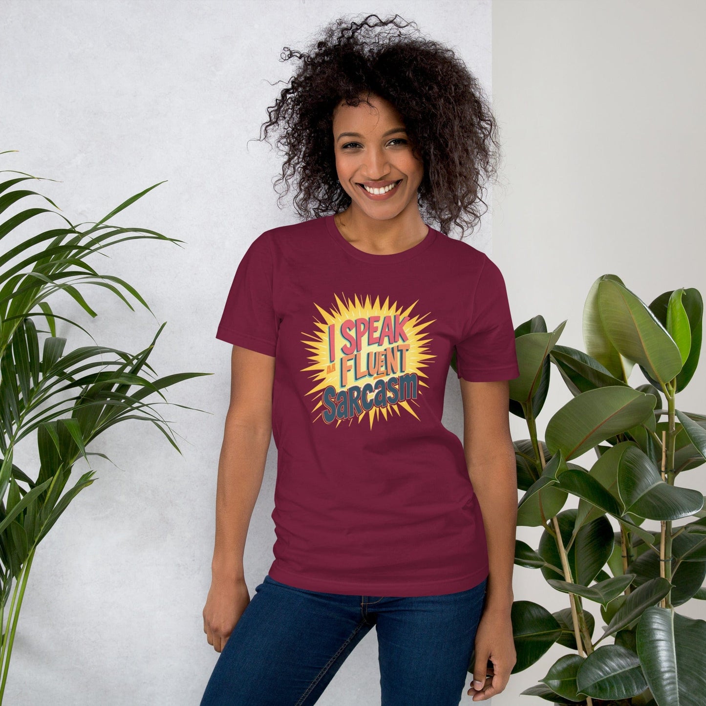 Woman wearing bordow T-shirt with bold comic-style I Speak Fluent Sarcasm quote design – ccanvas