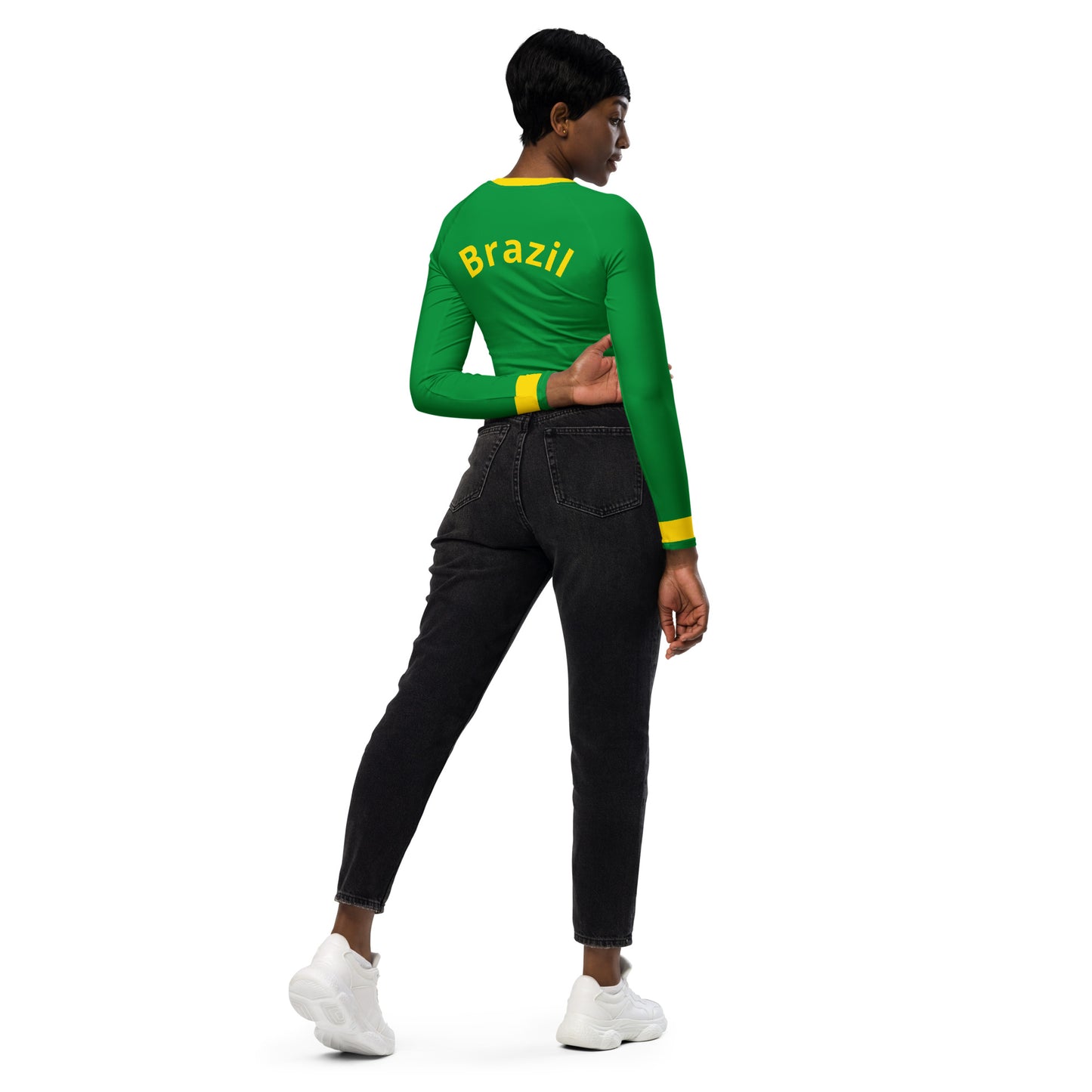 Full body view of model styling the Brazil heritage crop top with black biker shorts for a 2026 urban look.