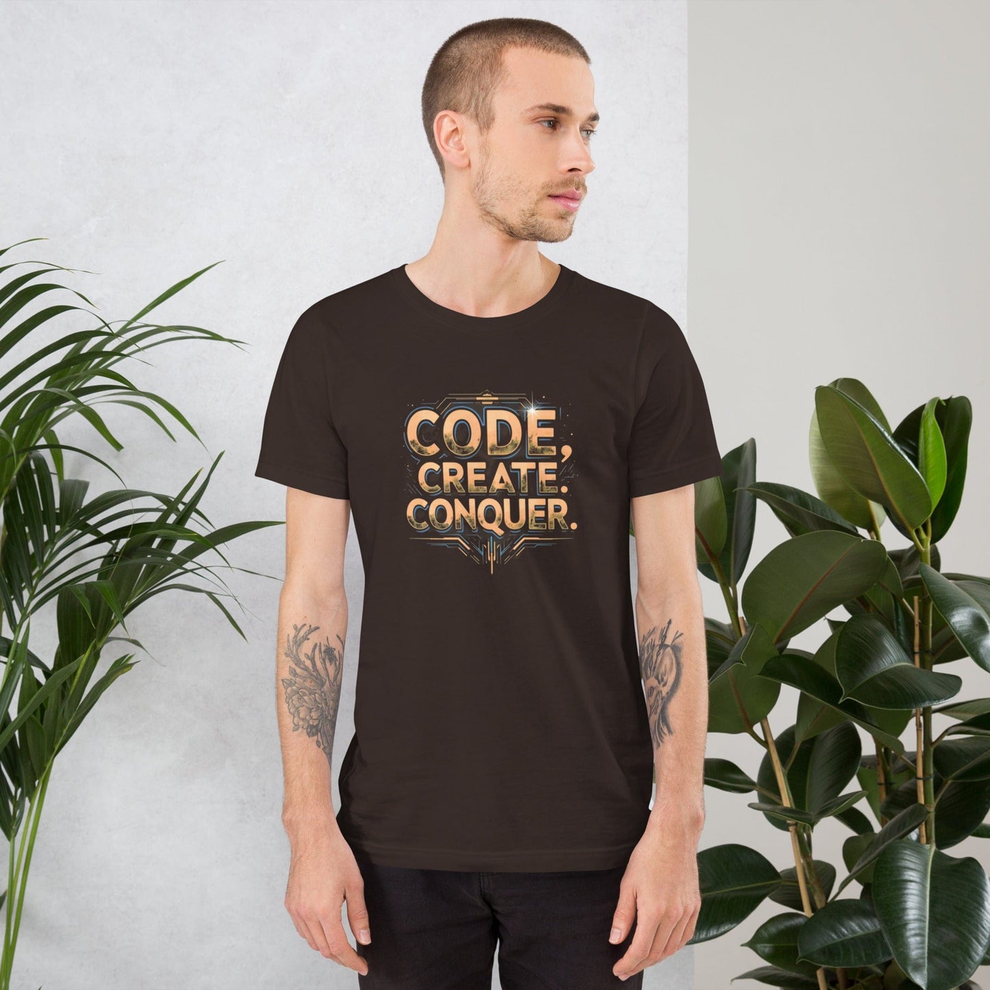 Man wearing charcoal tech-style Code Create Conquer T-shirt with orange digital print design – ccanvas