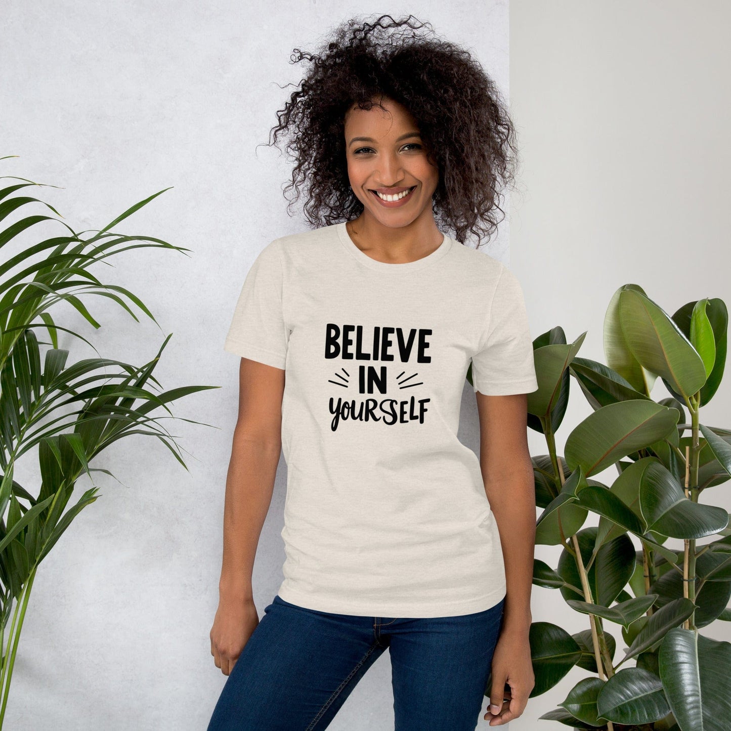 Smiling woman wearing creme Believe in Yourself T-shirt with black inspirational quote print – ccanvas