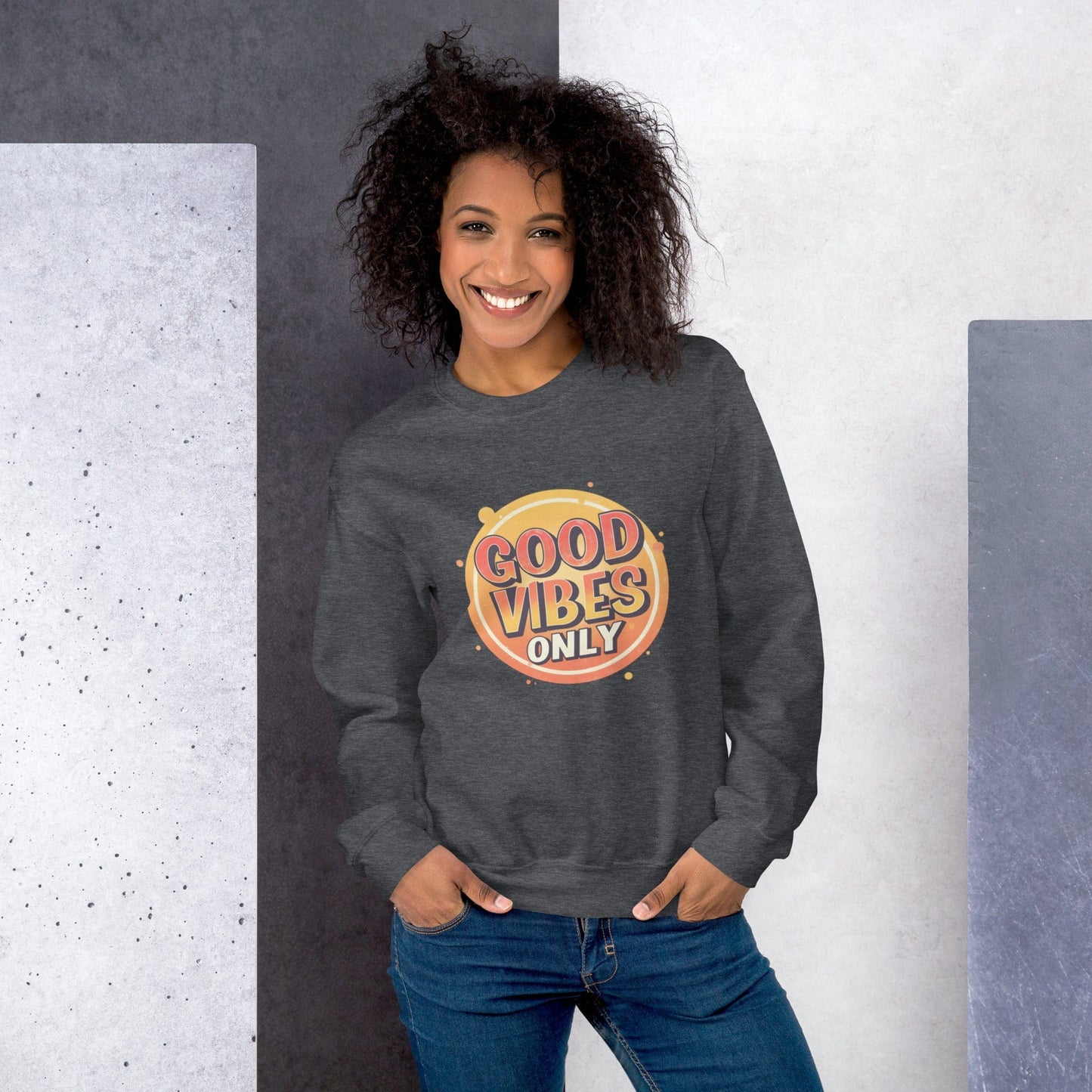 Smiling woman wearing dark grey sweatshirt with bold retro Good Vibes Only graphic design – ccanvas