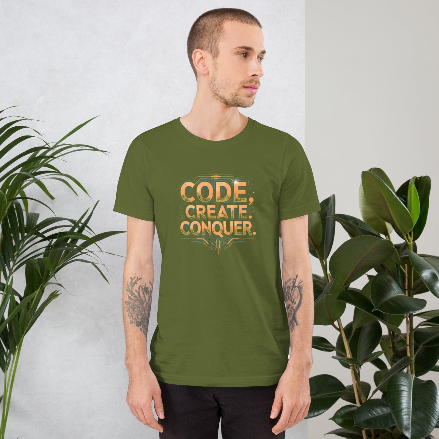 Man wearing grass tech-style Code Create Conquer T-shirt with orange digital print design – ccanvas