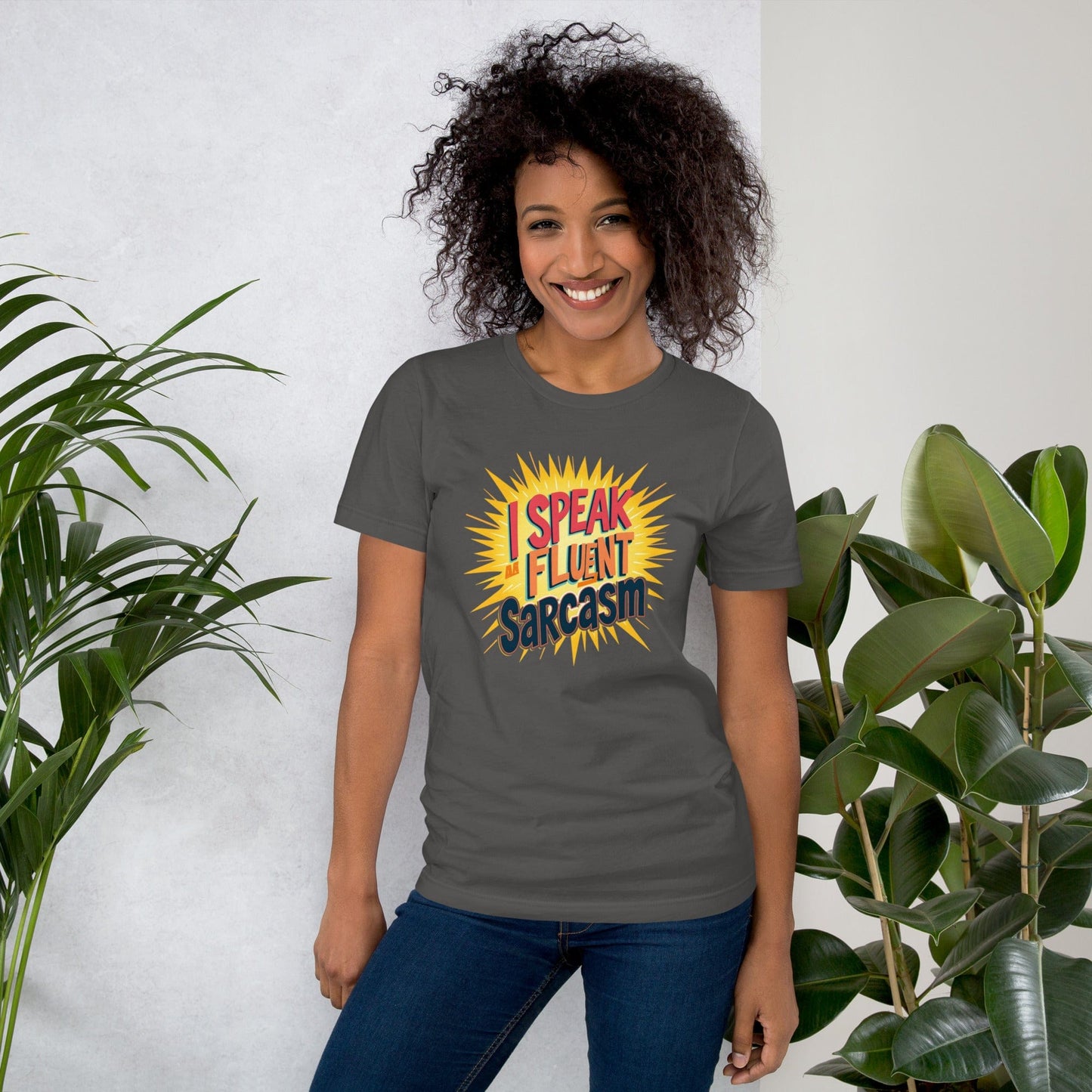 Woman wearing gray T-shirt with bold comic-style I Speak Fluent Sarcasm quote design – ccanvas