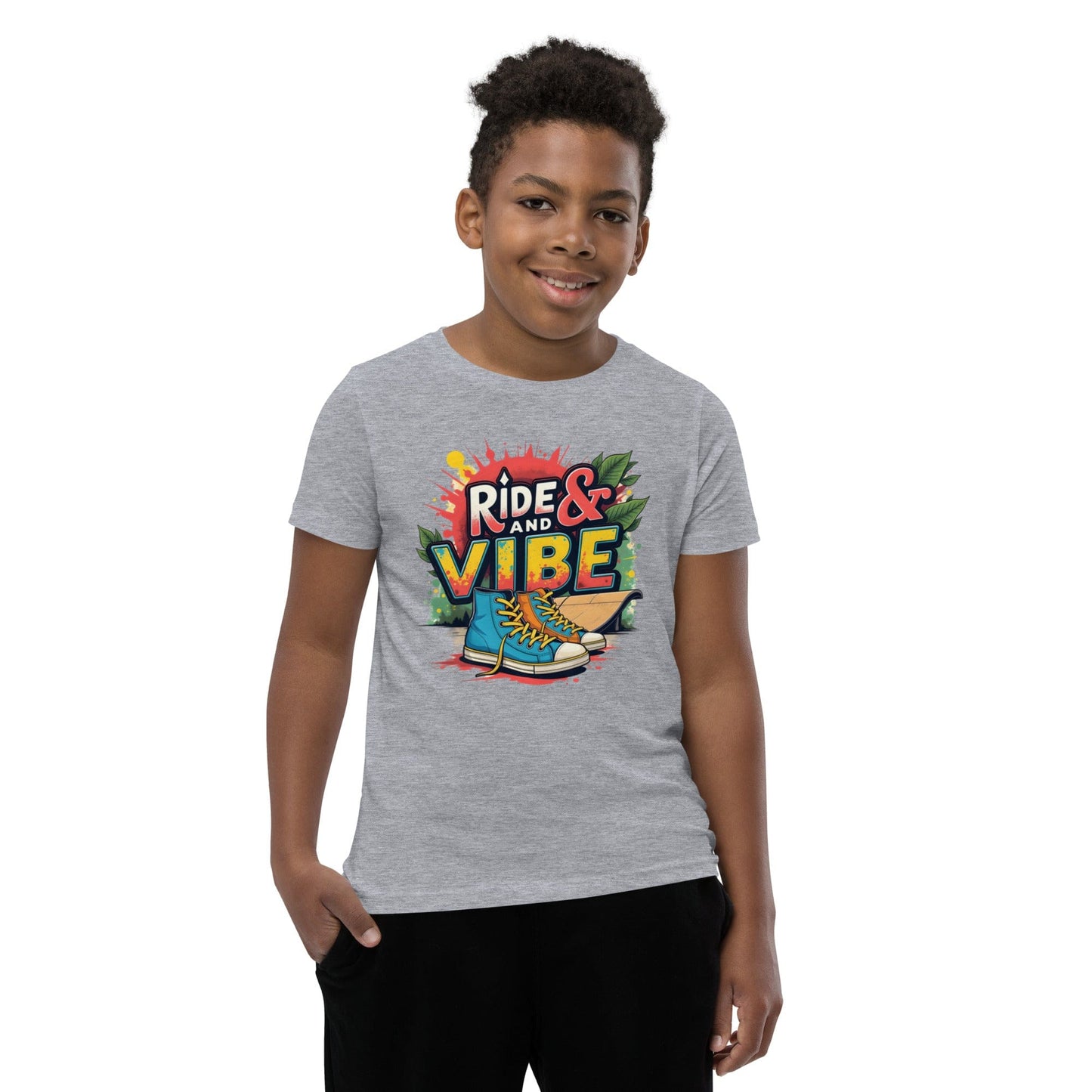 Boy wearing grey T-shirt with “Ride & Vibe” graffiti print, high-top shoes and skateboard over colorful splash – ccanvas