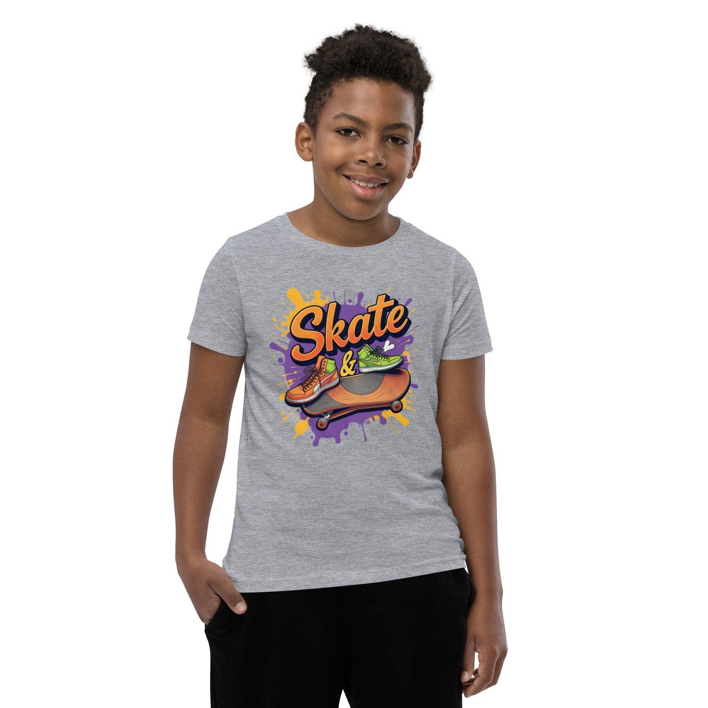 Kid wearing grey T-shirt with “Skate &” text, sneakers, skateboard, and splash graffiti in purple and orange – ccanvas