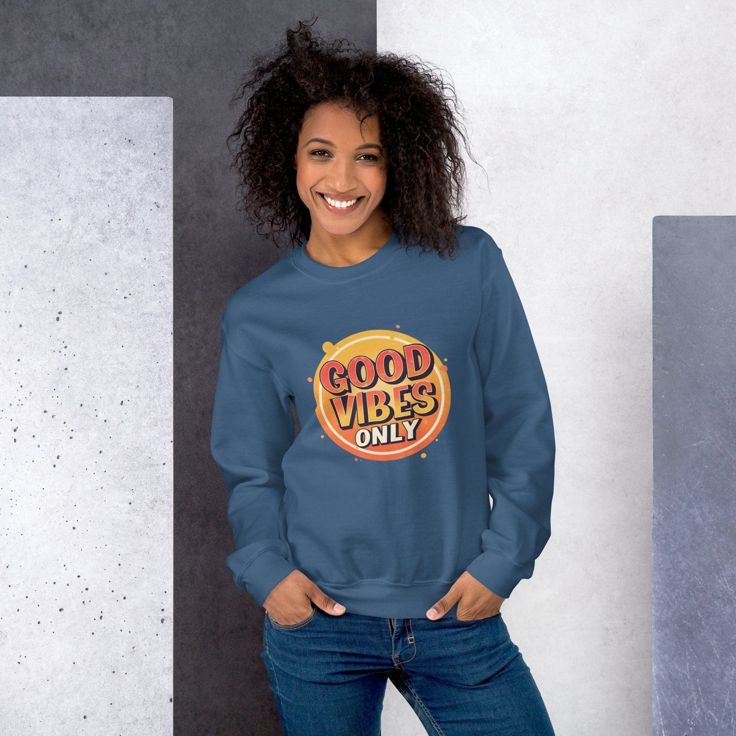 Smiling woman wearing light blue sweatshirt with bold retro Good Vibes Only graphic design – ccanvas