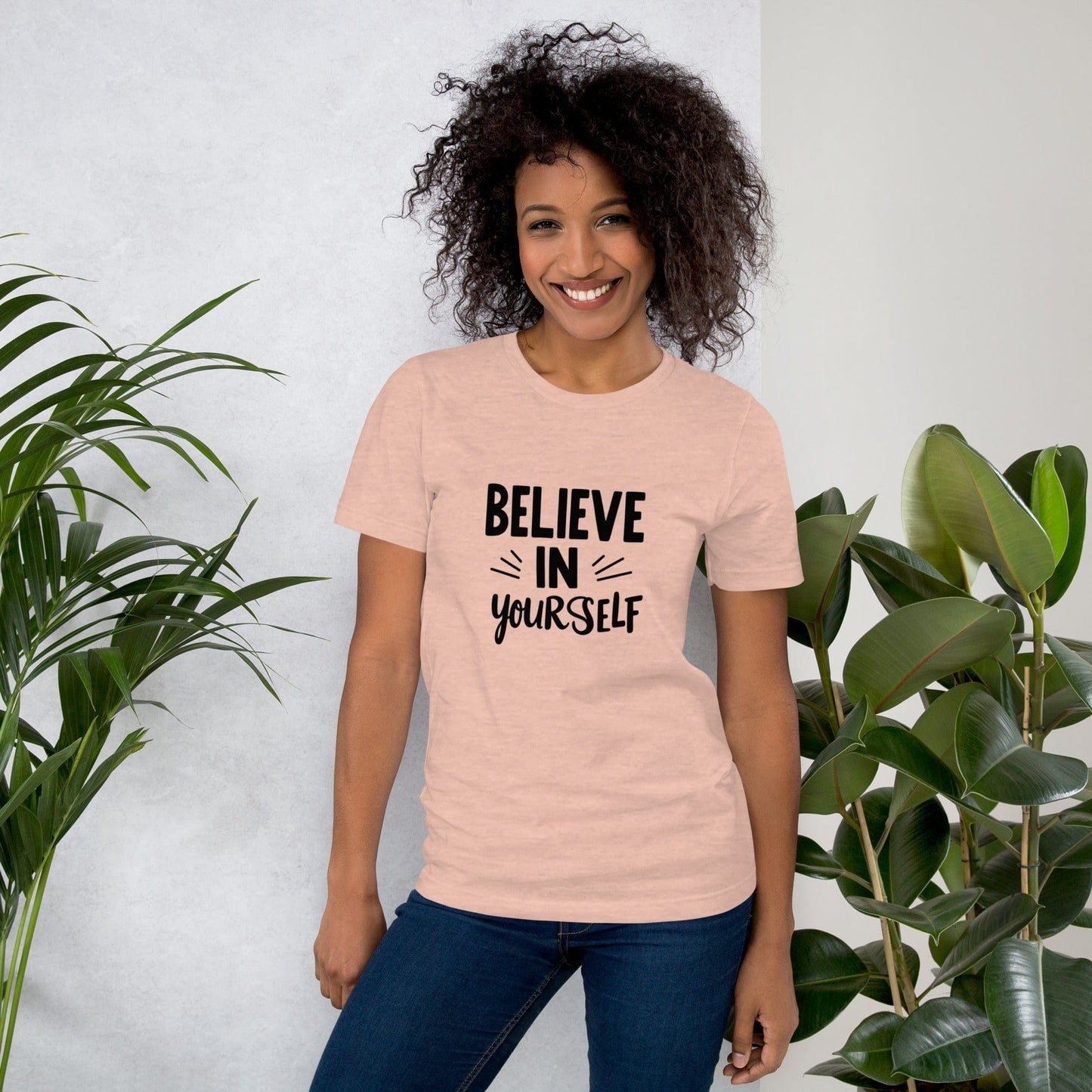 Smiling woman wearing light brown Believe in Yourself T-shirt with black inspirational quote print – ccanvas