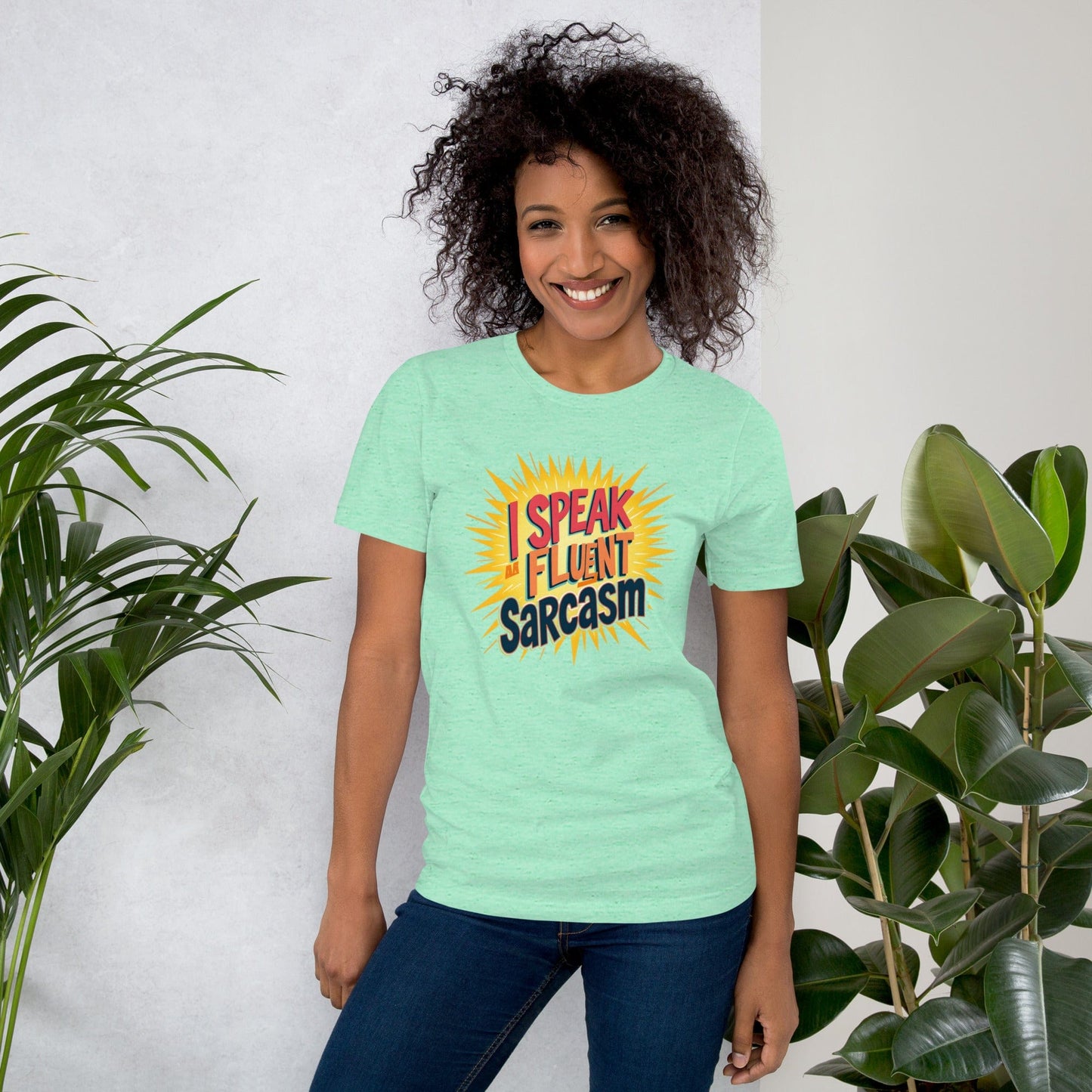 Woman wearing light green T-shirt with bold comic-style I Speak Fluent Sarcasm quote design – ccanvas