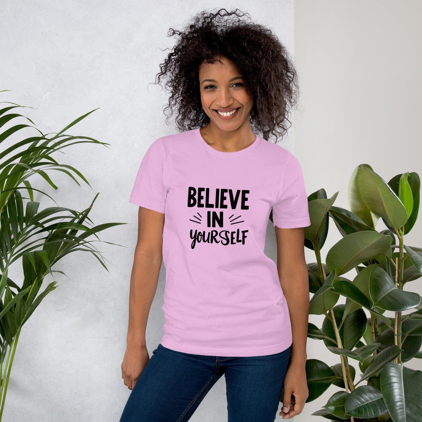 Smiling woman wearing lilac Believe in Yourself T-shirt with black inspirational quote print – ccanvas