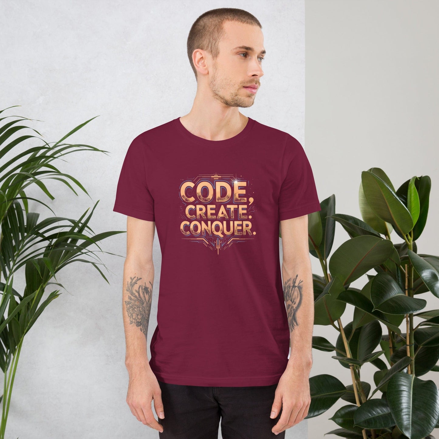Man wearing mid red tech-style Code Create Conquer T-shirt with orange digital print design – ccanvas