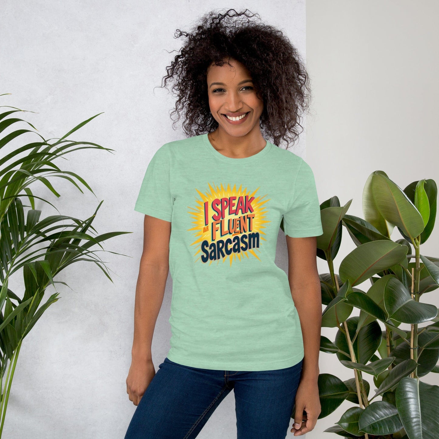 Woman wearing mint T-shirt with bold comic-style I Speak Fluent Sarcasm quote design – ccanvas