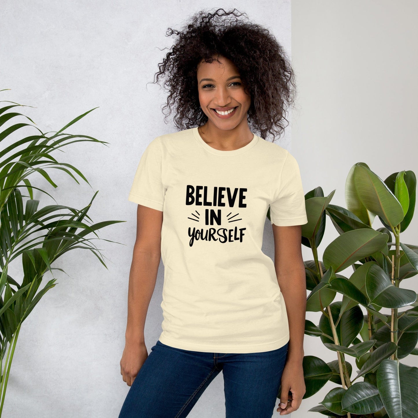 Smiling woman wearing mustard Believe in Yourself T-shirt with black inspirational quote print – ccanvas