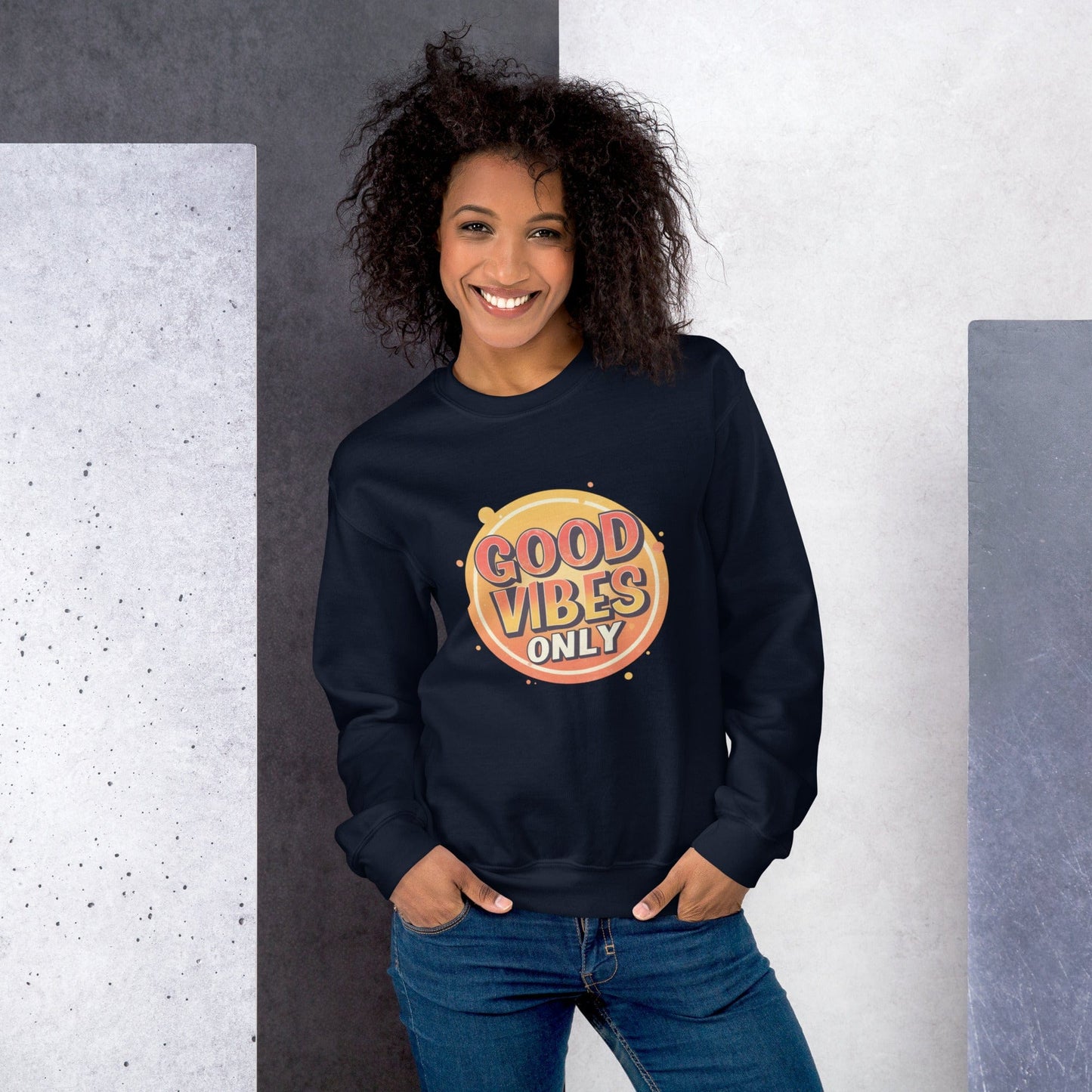 Smiling woman wearing navy sweatshirt with bold retro Good Vibes Only graphic design – ccanvas