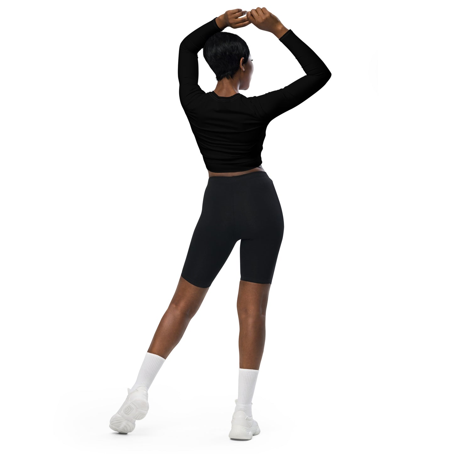 Woman wearing red polka dot crop top with patchwork design and black sleeves, fitted long-sleeve cut Vs 2