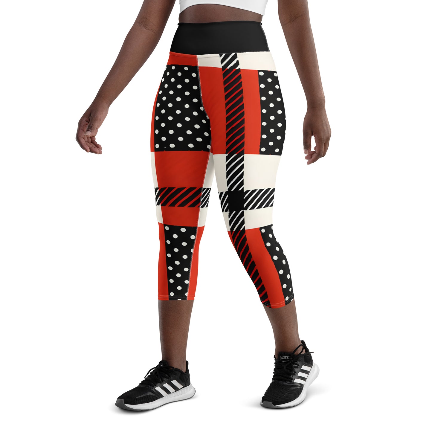 Back view of model wearing patriotic red, white, and blue USA heritage leggings for high-energy fitness.