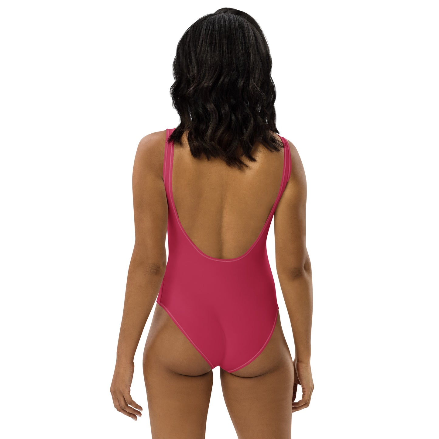 Rear view of women's Magenta Muse swimsuit showing the dramatic low-scoop back and cheeky athletic cut by CCANVAS.