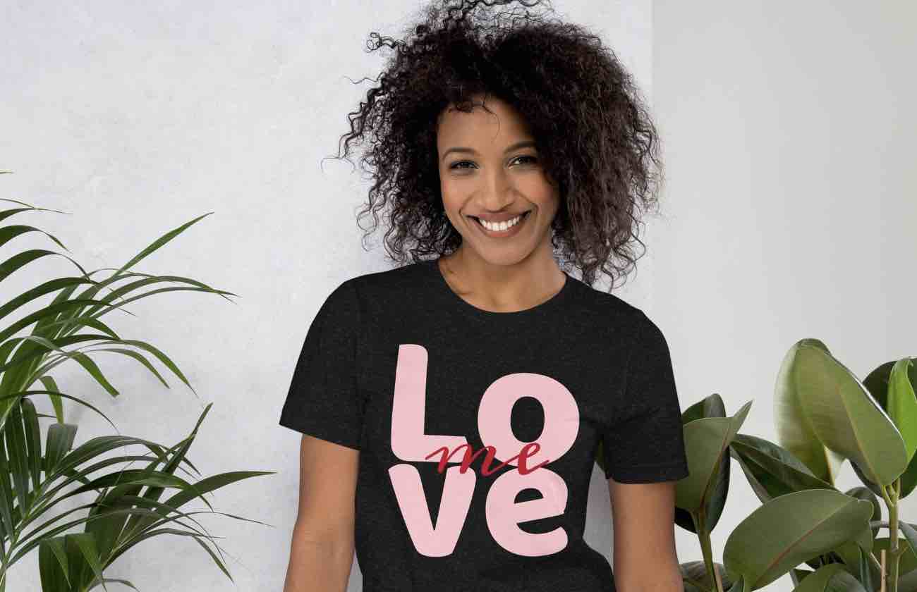 Smiling woman in black LOVE T-shirt – featured statement tee by ccanvas