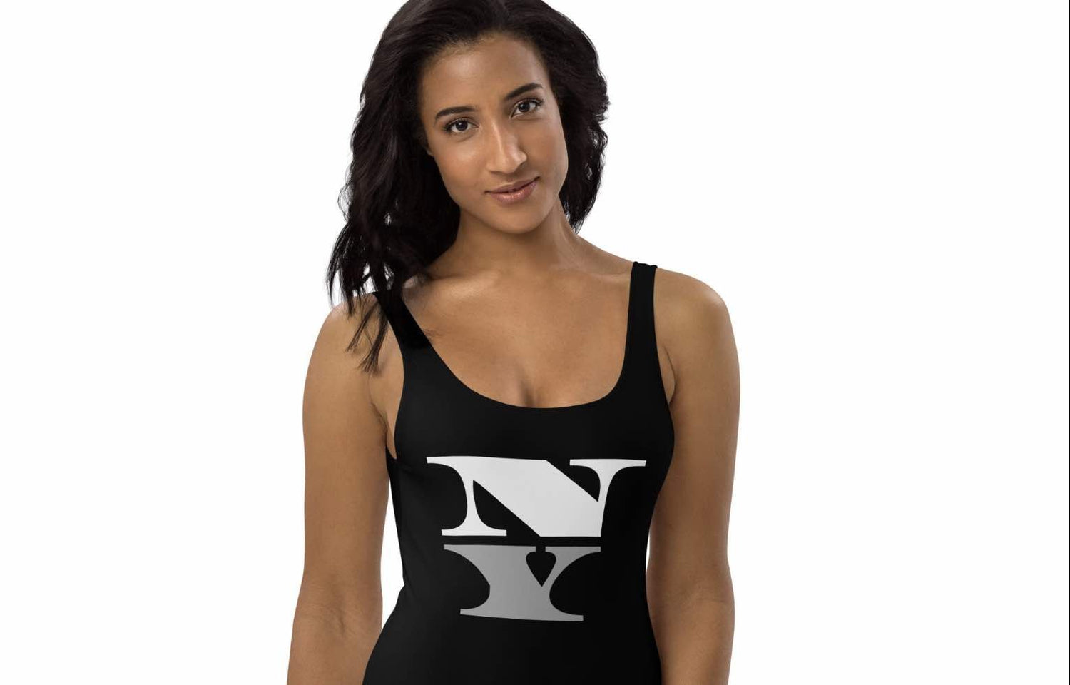 Model wearing NY monochrome one-piece swimsuit from ccanvas women’s swimwear collection, shot front-facing on white background
