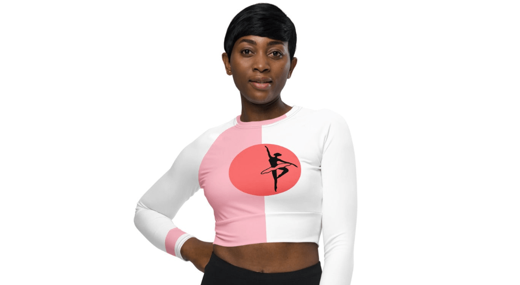 Woman in cropped white and pink streetwear top with logo print – bold women’s tracksuit fashion by ccanvas