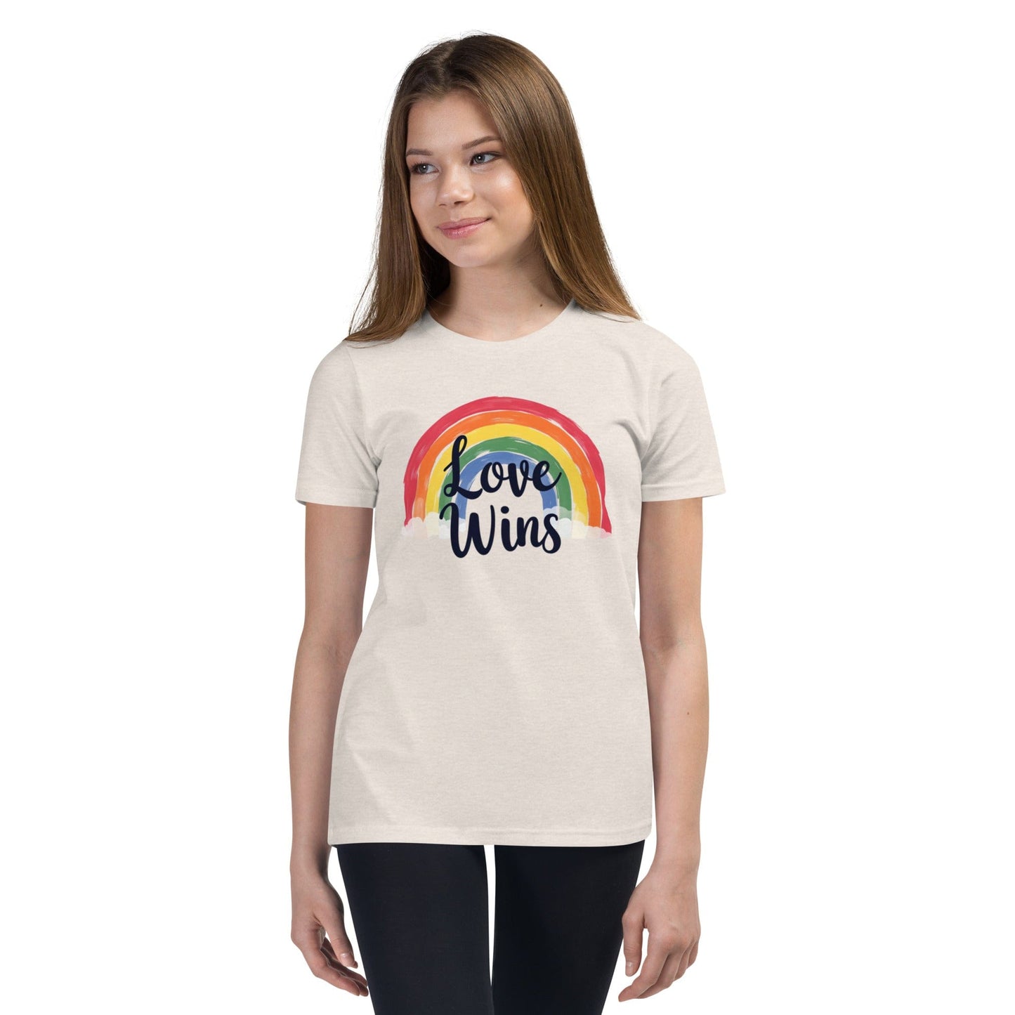 Woman wearing beige Love Wins rainbow pride T-shirt with LGBTQ message – ccanvas