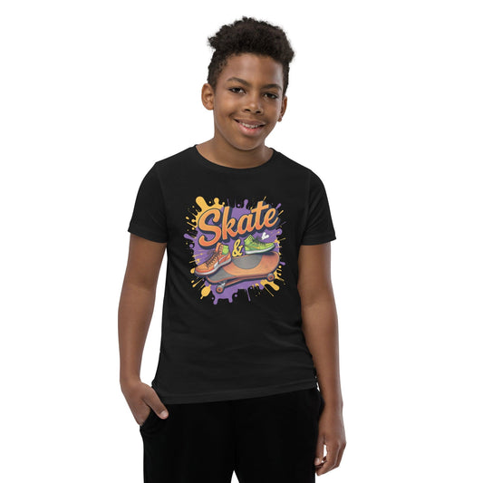 Kid wearing black T-shirt with “Skate &” text, sneakers, skateboard, and splash graffiti in purple and orange – ccanvas