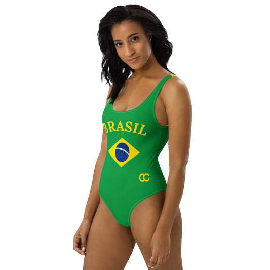 Side view of model in a green and yellow Brazil heritage one-piece showing the scoop neckline.
