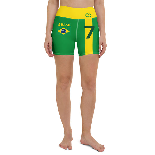 Model standing in green Brazil heritage yoga shorts featuring flag icon and number 7 graphic by CCANVAS.
