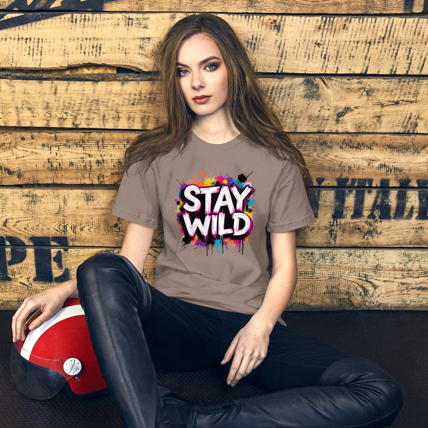 Woman wearing light brown Stay Wild t-shirt with colorful graffiti splash design – ccanvas