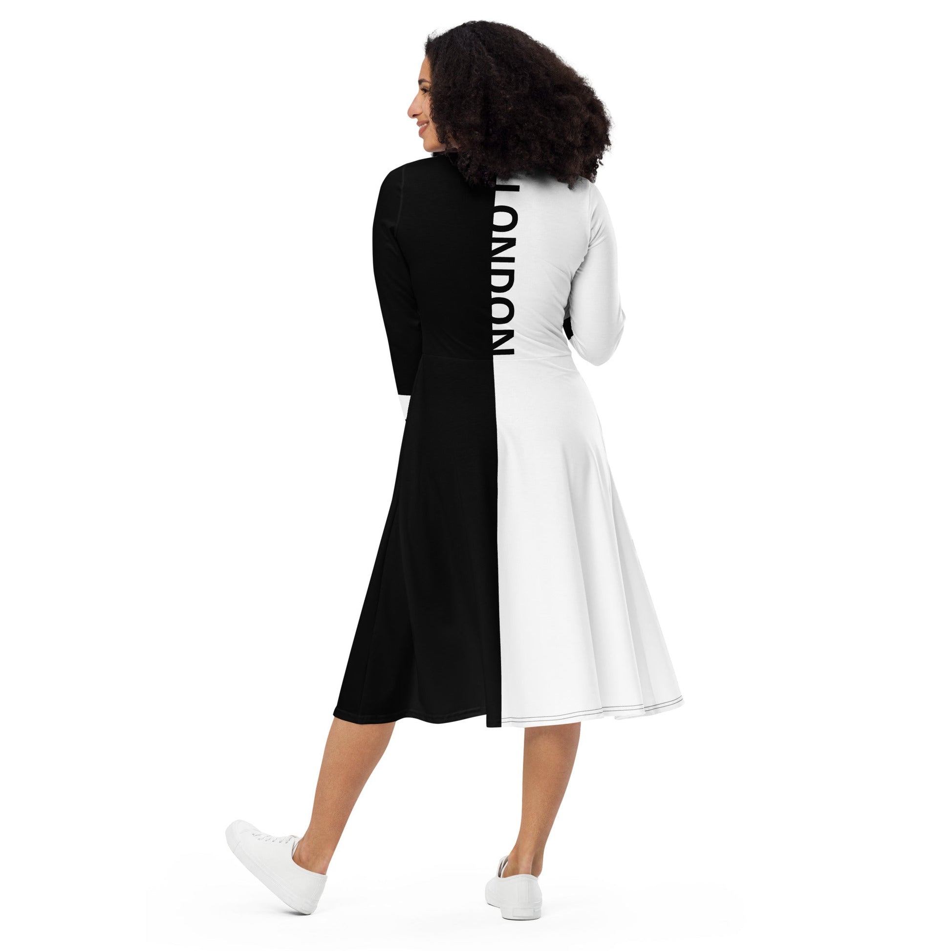 Woman wearing black and white split midi dress with bold vertical “London” text – ccanvas Vs 1
