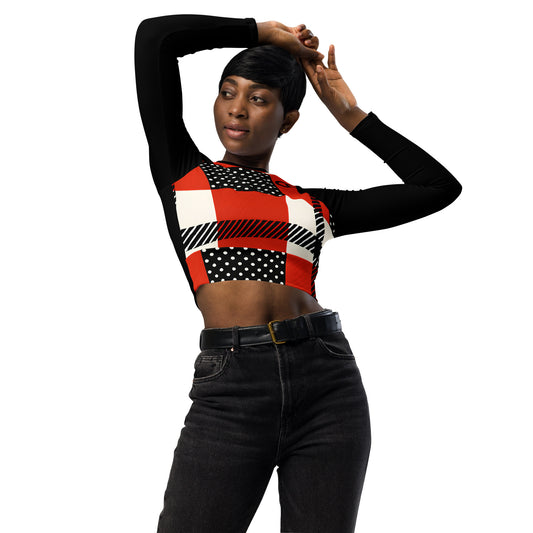 Woman wearing red polka dot crop top with patchwork design and black sleeves, fitted long-sleeve cut Vs 1