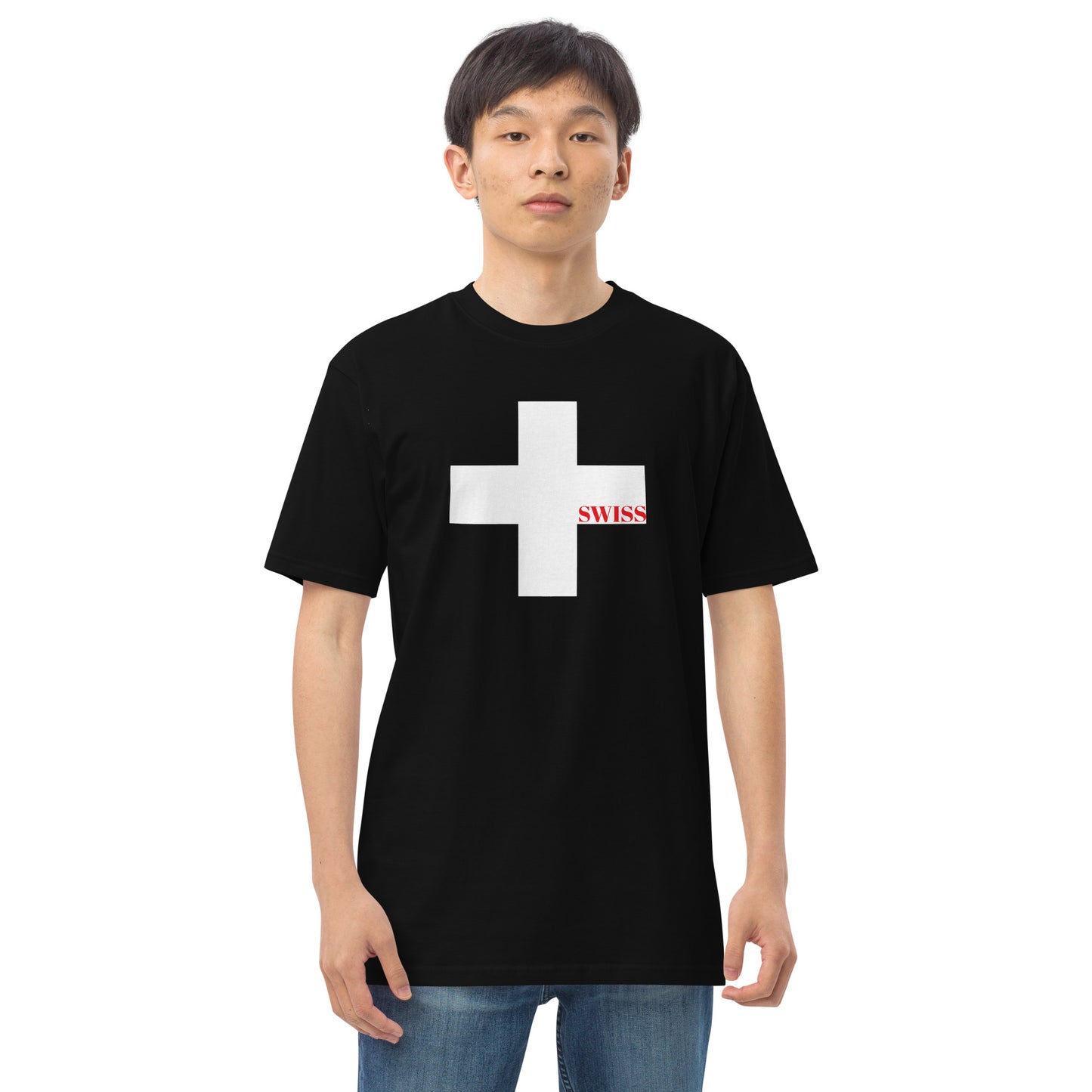 Model wearing a black Swiss heritage t-shirt with a large white Swiss cross and red text by CCANVAS.

