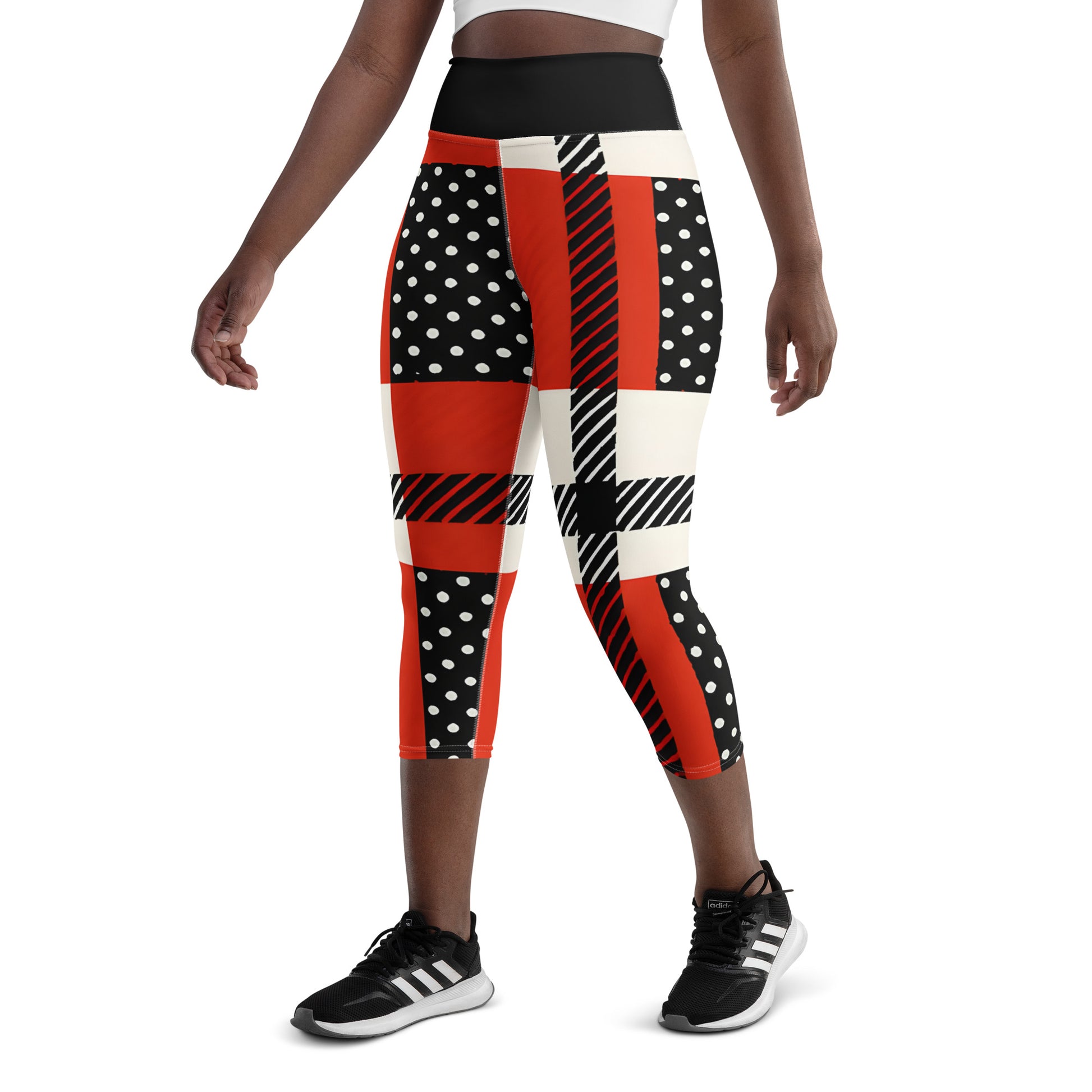 Back view of model wearing patriotic red, white, and blue USA heritage leggings for high-energy fitness.
