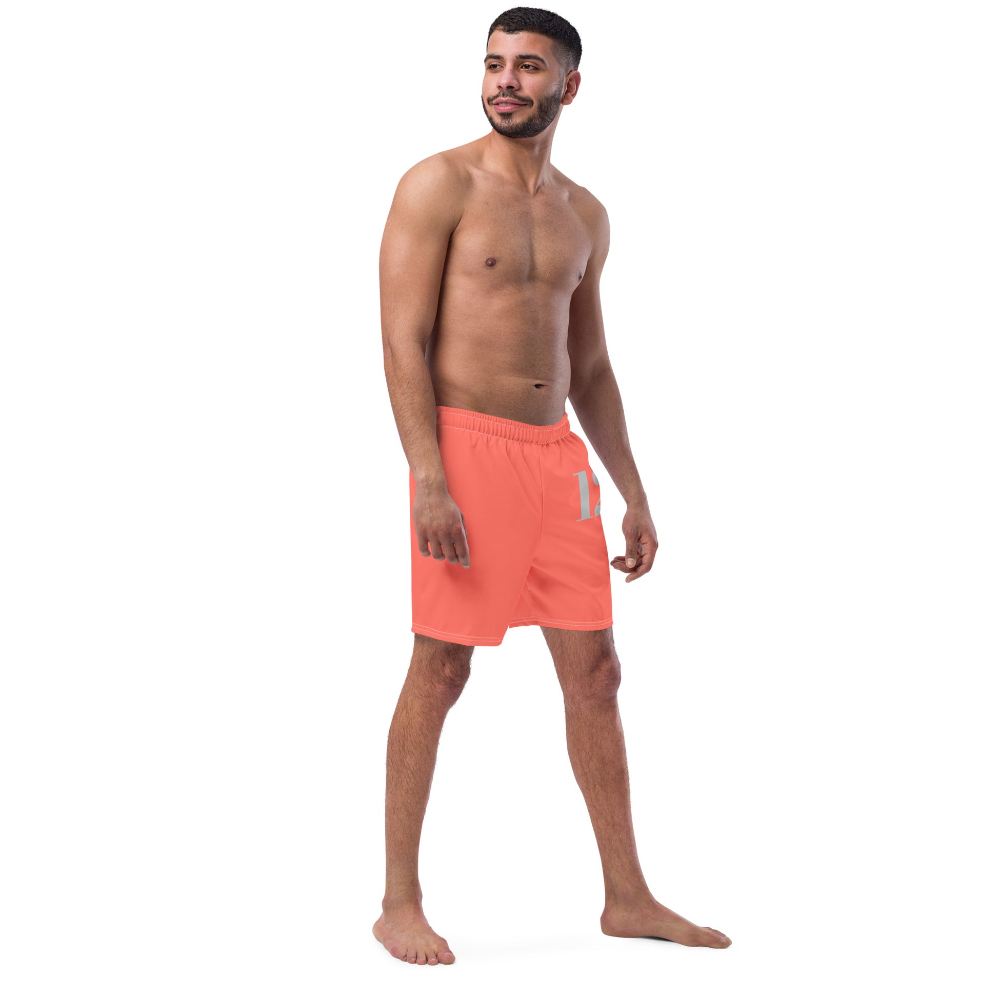 Side view of Crimson Pulse boardshorts showing the high-mobility fit and integrated functional pocket by CCANVAS.
