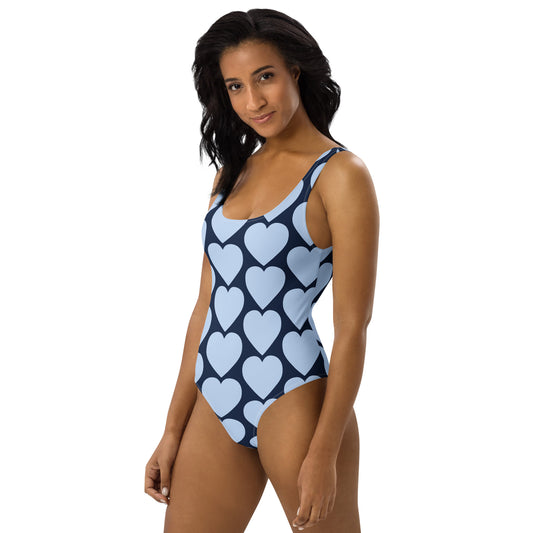 Side profile of a sculpted graphic swimsuit showing high-performance stretch and athletic fit by CCANVAS.
