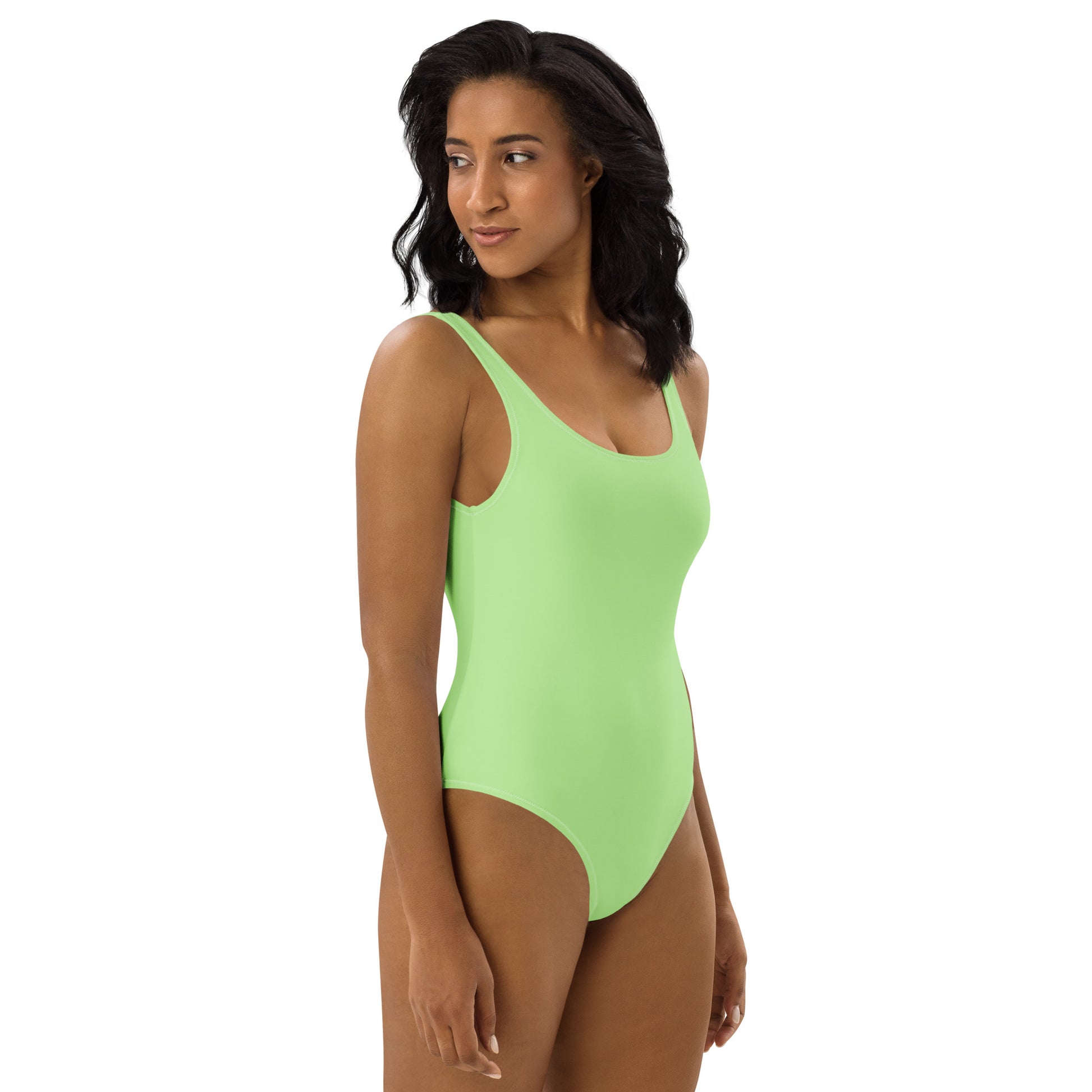 Side profile of women's Lime Muse neon swimsuit highlighting the body-sculpting athletic fit by CCANVAS.
