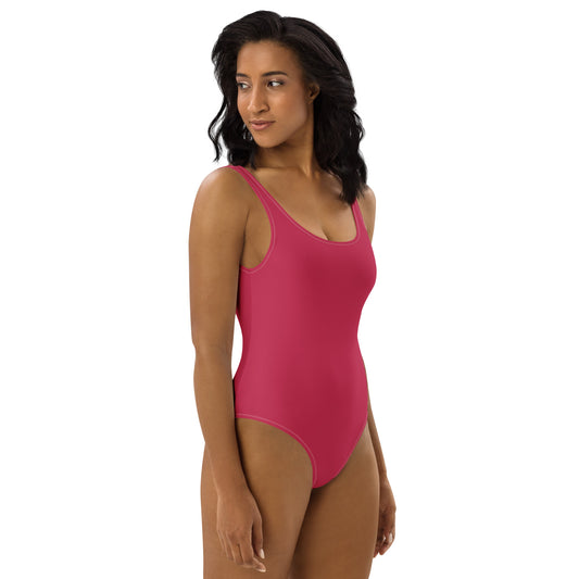 Side profile of women's Magenta Muse swimsuit highlighting the body-sculpting fit and premium athletic fabric by CCANVAS.
